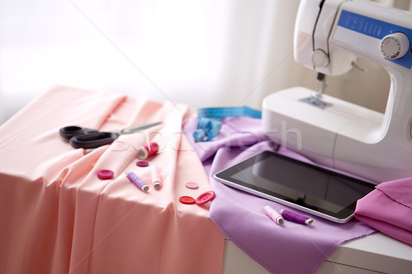 sewing machine, tablet pc, scissors and ruler Stock photo © dolgachov