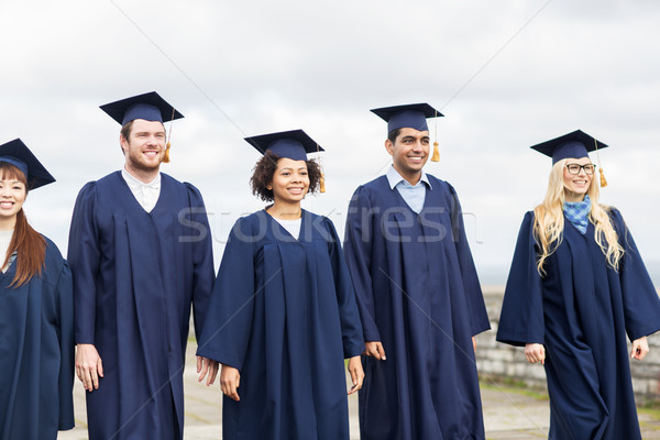 Fericit studenţi burlaci educaţie absolvire oameni Imagine de stoc © dolgachov