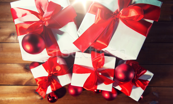 close up of gift boxes and red christmas balls Stock photo © dolgachov