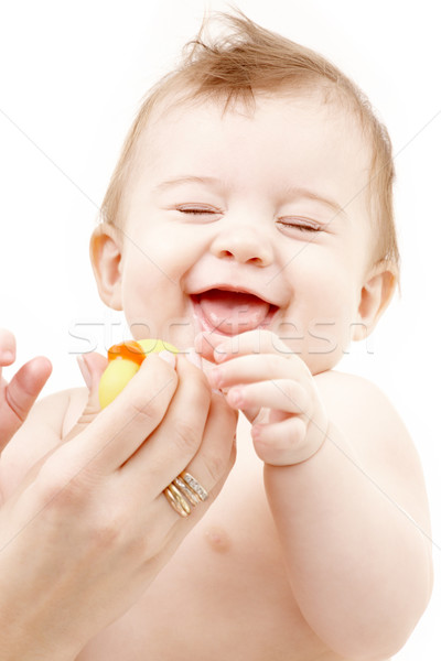 [[stock_photo]]: Rire · bébé · garçon · mère · mains · caoutchouc