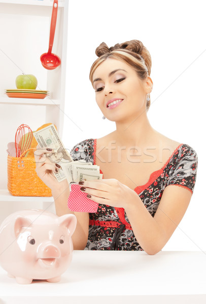 beautiful housewife with purse and money Stock photo © dolgachov