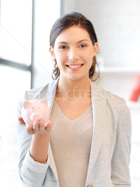 lovely woman with piggy bank Stock photo © dolgachov