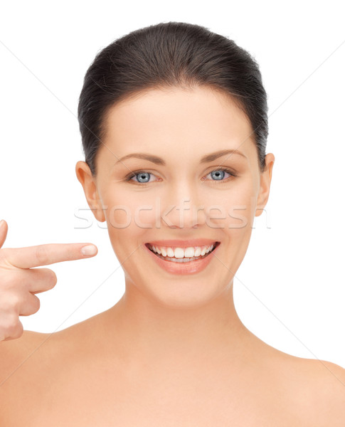 Mujer hermosa senalando dientes Foto mujer mano Foto stock © dolgachov