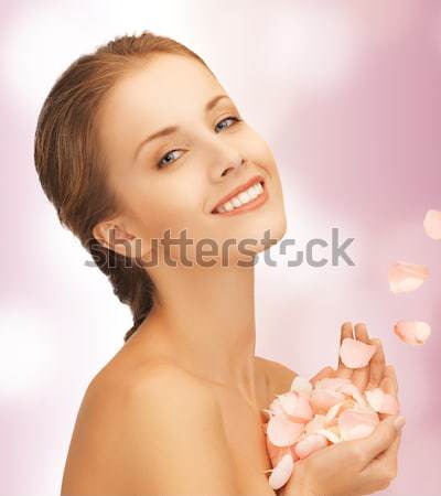 beautiful woman with rose petals Stock photo © dolgachov