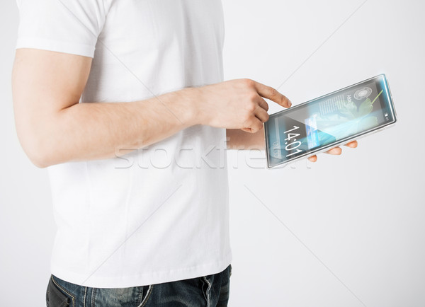 man with tablet pc reading news Stock photo © dolgachov