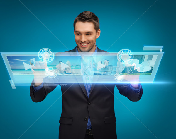 businessman pressing buttons on virtual screen Stock photo © dolgachov
