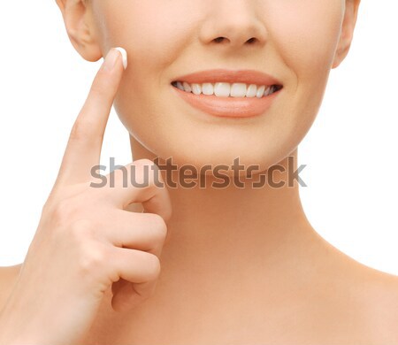 beautiful woman applying moisturizing cream Stock photo © dolgachov
