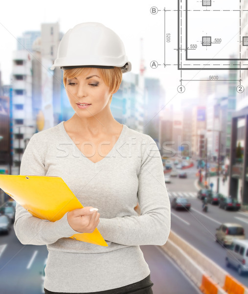 Feminino capacete dobrador edifício em desenvolvimento Foto stock © dolgachov