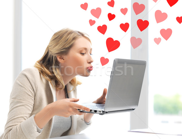 woman sending kisses with laptop computer Stock photo © dolgachov