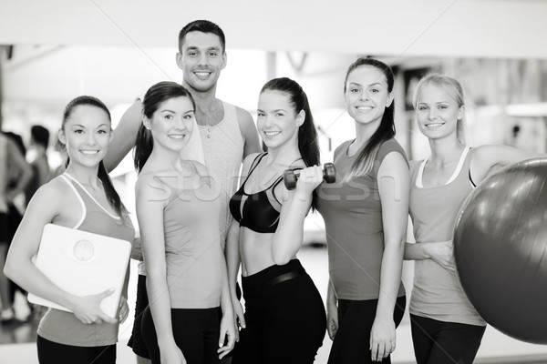 группа улыбаясь люди спортзал фитнес спорт Сток-фото © dolgachov