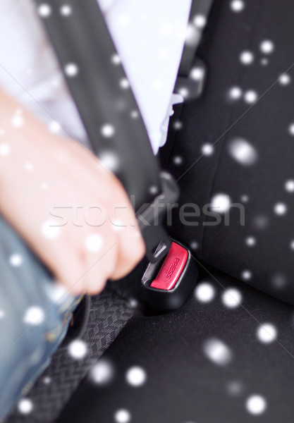 close up of man fastening seat belt in car Stock photo © dolgachov