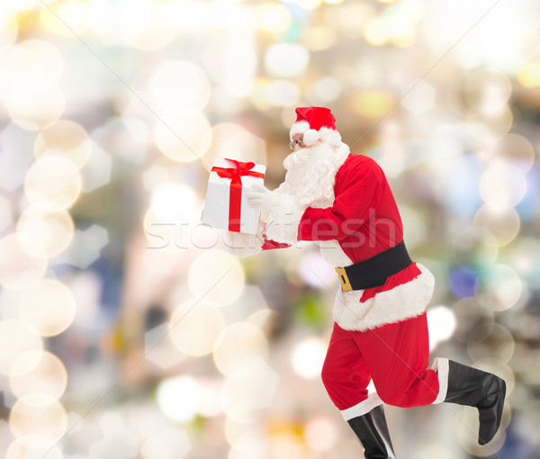 Adam kostüm noel baba hediye kutusu Noel tatil Stok fotoğraf © dolgachov