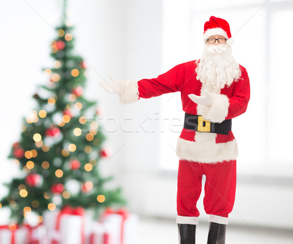man in costume of santa claus Stock photo © dolgachov