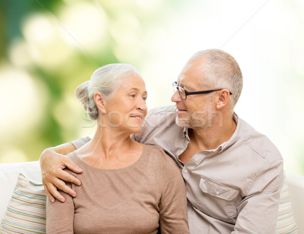 Feliz pareja de ancianos sofá casa familia Foto stock © dolgachov