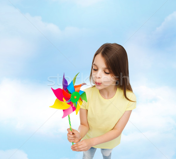 Stock photo: smiling child with colorful windmill toy