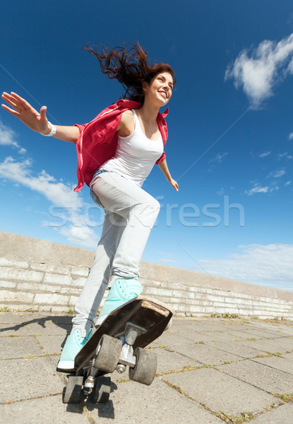 teenage girl skating outside Stock photo © dolgachov