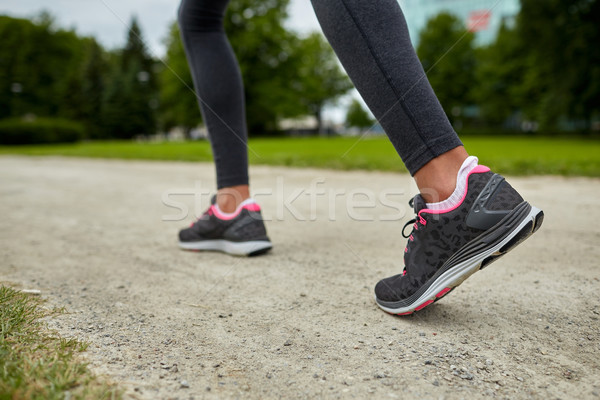 close up of woman feet running on track from back Stock photo © dolgachov