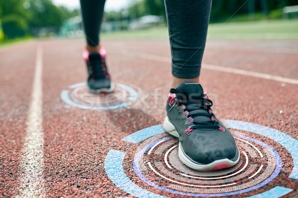 close up of woman feet running on track Stock photo © dolgachov