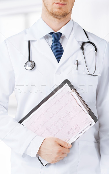 nurse and male doctor holding cardiogram Stock photo © dolgachov