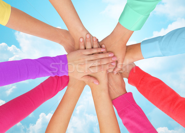 close up of women hands on top in rainbow clothes Stock photo © dolgachov