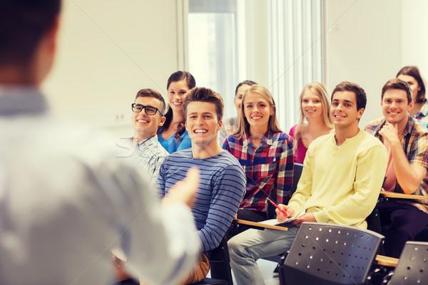 group of students and teacher with notebook Stock photo © dolgachov