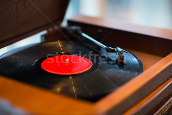 close up of vintage record player with vinyl disc Stock photo © dolgachov