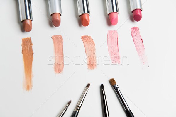 close up of lipsticks range with makeup brushes Stock photo © dolgachov