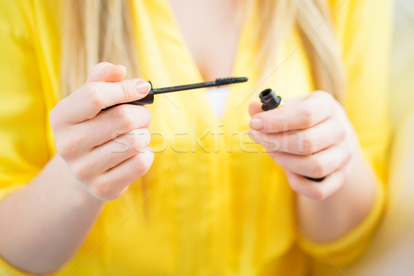 close up of woman with mascara applying makeup Stock photo © dolgachov