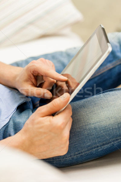 close up of man working with tablet pc at home Stock photo © dolgachov