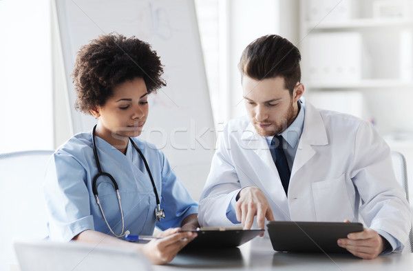 two doctors meeting at hospital office Stock photo © dolgachov