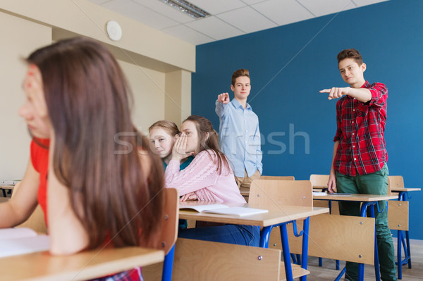 Diákok pletykál mögött osztálytárs hát iskola Stock fotó © dolgachov