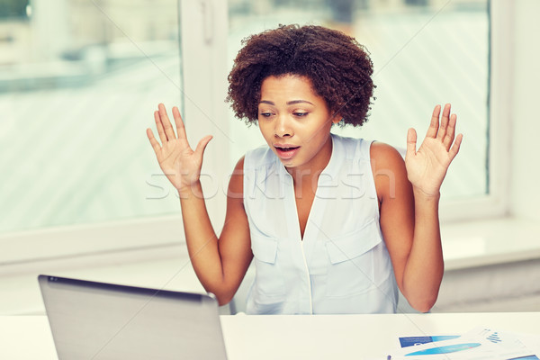 Stock photo: african woman with laptop at office