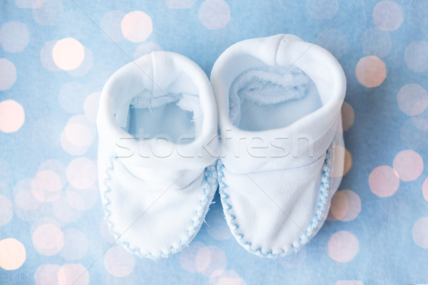 close up of baby bootees for newborn boy on blue Stock photo © dolgachov