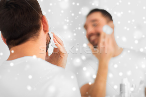 close up of man applying shaving foam to face Stock photo © dolgachov