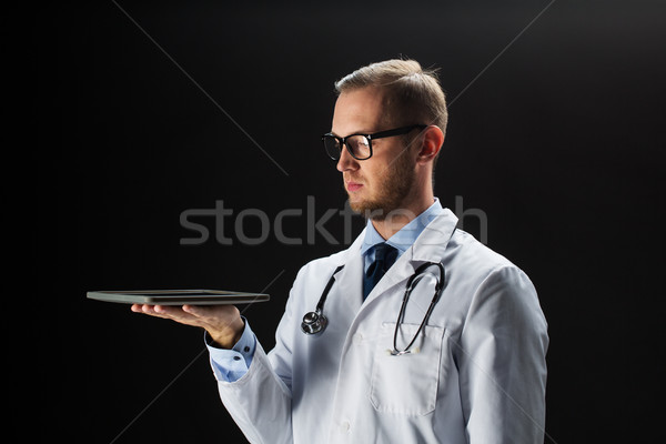 doctor with tablet pc and stethoscope Stock photo © dolgachov