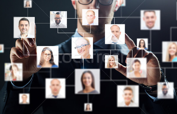 close up of businessman with virtual contact icons Stock photo © dolgachov