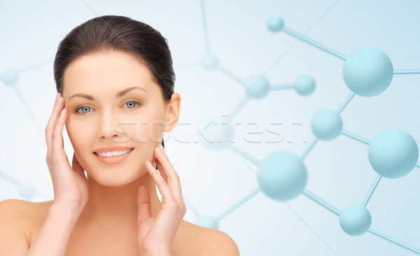 beautiful young woman face with molecules Stock photo © dolgachov