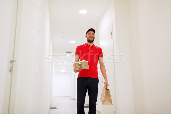 man delivering coffee and food to customer home Stock photo © dolgachov