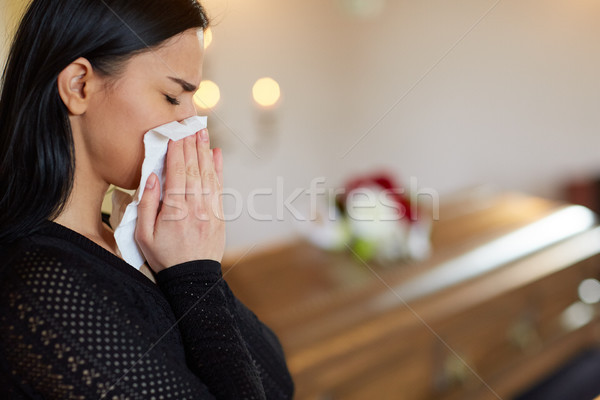 woman crying near coffin at funeral in church Stock photo © dolgachov