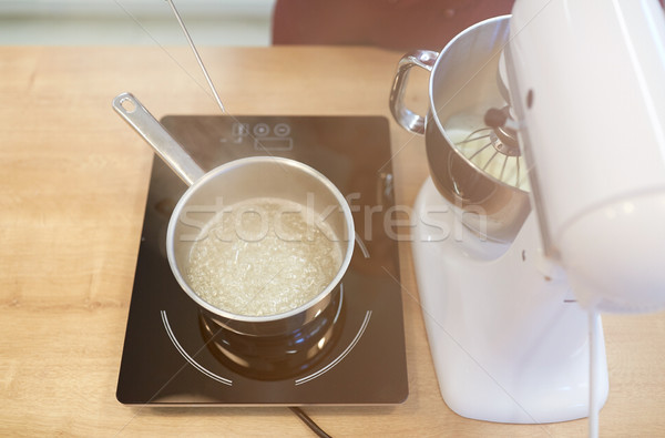 electric mixer and pot on stove at kitchen Stock photo © dolgachov