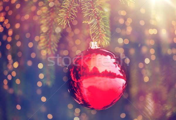 Stock photo: red christmas ball on fir tree branch with snow