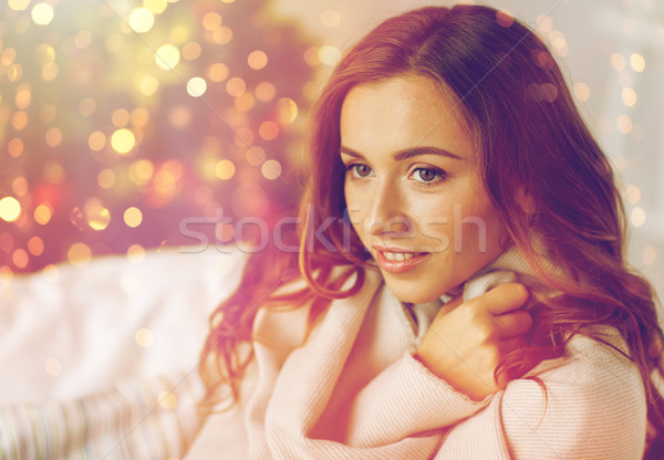 happy young woman with plaid at home for christmas Stock photo © dolgachov