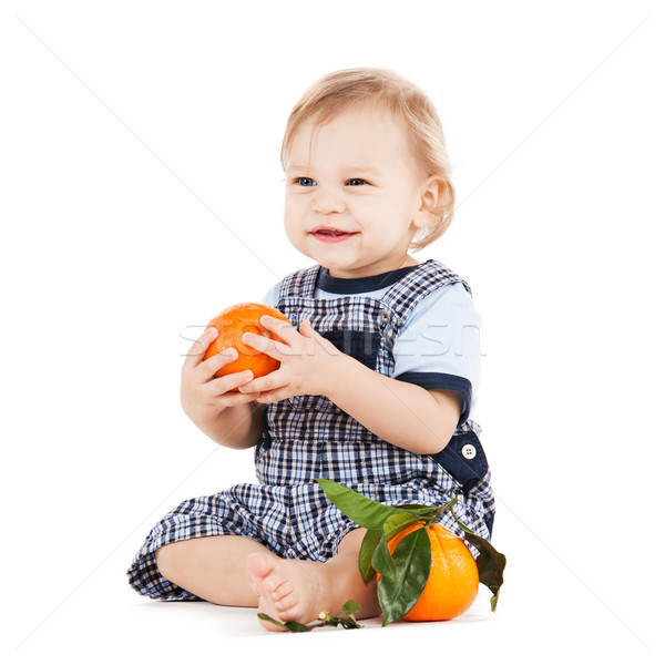 Bonitinho criança alimentação laranja infância alimentação saudável Foto stock © dolgachov