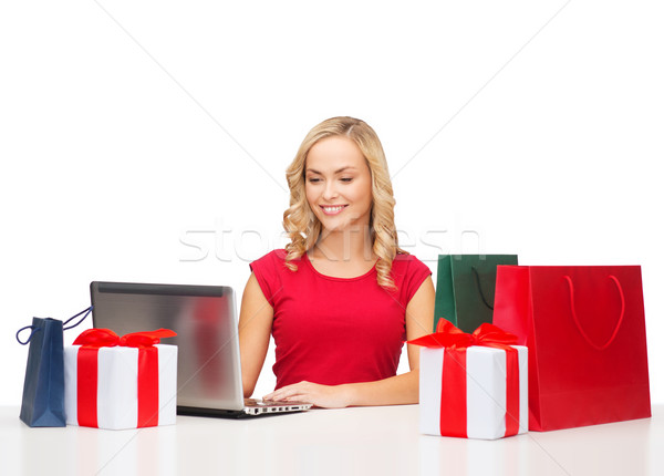 woman with gift boxes, bags and laptop computer Stock photo © dolgachov