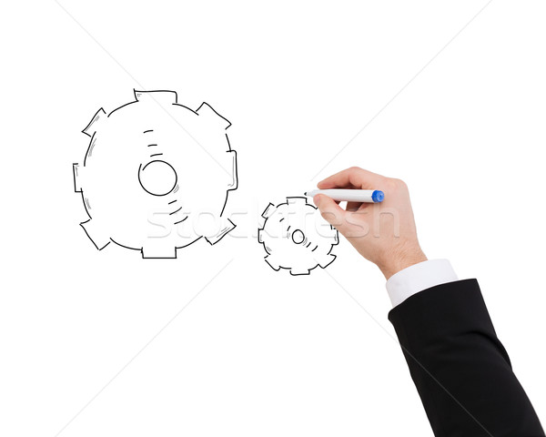 close up of businessman drawing cogwheel Stock photo © dolgachov