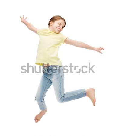 smiling little girl jumping Stock photo © dolgachov