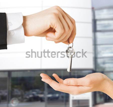 man and woman with house keys Stock photo © dolgachov