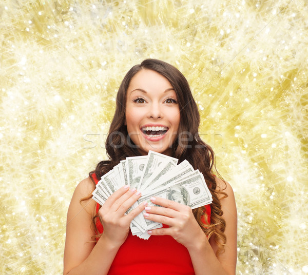 woman in red dress with us dollar money Stock photo © dolgachov