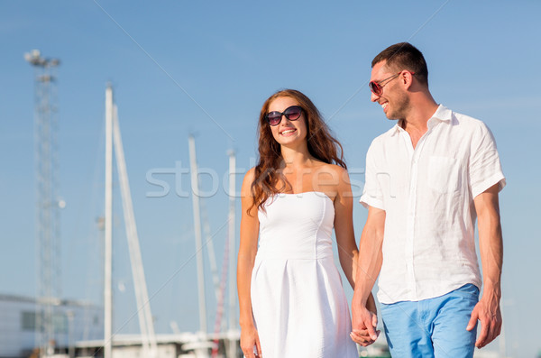 smiling couple in city Stock photo © dolgachov