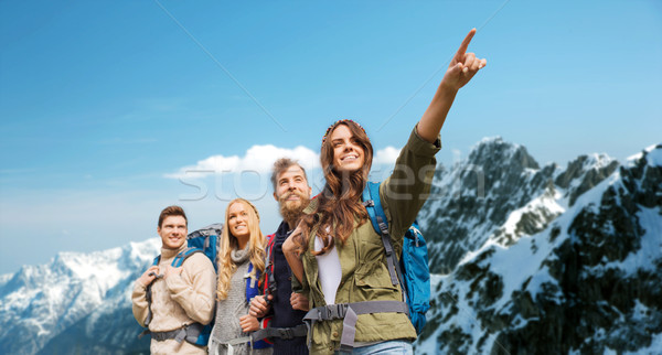 group of smiling friends with backpacks hiking Stock photo © dolgachov